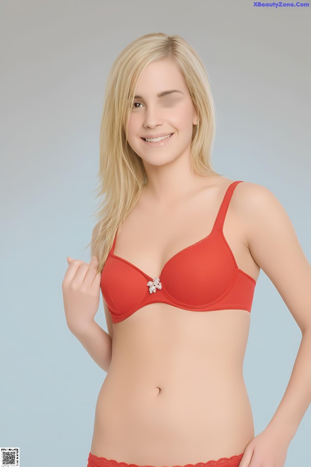 A woman in a red bra and panties posing for a picture.